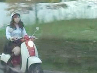 Japanese hottie pleasures her pussy in public while cycling through the bustling streets of Nippon's capital with a big hard cock